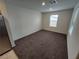 Bedroom with a window, plush carpet, and neutral paint at 247 Desoto Falls St, Indian Springs, NV 89018