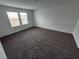 Bedroom with wall-to-wall carpeting and natural light at 247 Desoto Falls St, Indian Springs, NV 89018
