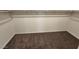 Walk-in closet featuring neutral carpet and wood clothing rod at 247 Desoto Falls St, Indian Springs, NV 89018