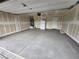 Spacious two car garage features concrete flooring, drywall, and ample storage potential at 247 Desoto Falls St, Indian Springs, NV 89018