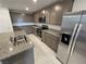 Spacious kitchen featuring stainless steel appliances, granite countertops, and ample storage space at 247 Desoto Falls St, Indian Springs, NV 89018
