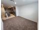 View of the living room and modern kitchen in this open floor plan at 247 Desoto Falls St, Indian Springs, NV 89018
