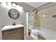 Cozy bathroom featuring a vanity with storage, a bathtub, and a decorative wall mirror at 2714 Bridgepointe Dr, Las Vegas, NV 89121