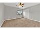 Bright bedroom with neutral walls, carpet floors, ceiling fan and a window that provides natural light at 2714 Bridgepointe Dr, Las Vegas, NV 89121