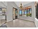 Cozy dining area with a chandelier and sliding glass door to the patio at 2714 Bridgepointe Dr, Las Vegas, NV 89121