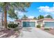 Charming single-story home featuring a well-maintained lawn and a two-car garage at 2714 Bridgepointe Dr, Las Vegas, NV 89121