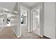 Inviting hallway offers seamless transitions into various rooms, with neutral tones and ample natural light at 2714 Bridgepointe Dr, Las Vegas, NV 89121