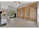 Bright living room showcasing a built-in bookshelf and sliding glass doors at 2714 Bridgepointe Dr, Las Vegas, NV 89121