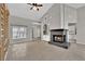 Spacious living room featuring a fireplace and high ceilings at 2714 Bridgepointe Dr, Las Vegas, NV 89121