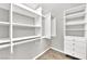 Organized walk-in closet with built-in shelves and hanging rods offers plenty of storage space at 2714 Bridgepointe Dr, Las Vegas, NV 89121