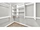 Spacious walk-in closet features custom shelving and ample room for storage at 2714 Bridgepointe Dr, Las Vegas, NV 89121