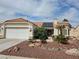 Charming single-story home with a well-manicured desert landscape and red tile roof at 2750 Sandalwood Ave, Henderson, NV 89074