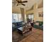 Cozy living room with plush sofas, a decorative rug, and bright natural light from large windows at 2750 Sandalwood Ave, Henderson, NV 89074