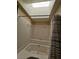 Bathroom featuring a shower-tub combo and skylight at 3145 E Flamingo Rd # 2005, Las Vegas, NV 89121