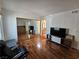Bright bedroom with hardwood floors, a mirrored closet, and an attached bathroom, providing ample space and convenience at 3145 E Flamingo Rd # 2005, Las Vegas, NV 89121