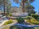 Attractive community entrance with lush landscaping and clear signage at 3145 E Flamingo Rd # 2005, Las Vegas, NV 89121