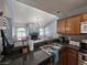 Modern kitchen with granite countertops that opens to a living room with a fireplace and ample natural light at 3145 E Flamingo Rd # 2005, Las Vegas, NV 89121