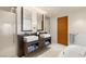 Modern bathroom features dual sinks, sleek cabinets, and a glass enclosed shower at 3750 Las Vegas Blvd # 3008, Las Vegas, NV 89158