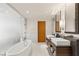 Modern bathroom features a standalone tub, dual sinks, and sleek wooden cabinets at 3750 Las Vegas Blvd # 3008, Las Vegas, NV 89158