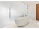 Modern bathroom features a standalone tub and sleek glass enclosed shower at 3750 Las Vegas Blvd # 3008, Las Vegas, NV 89158