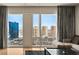 Bright city view from the living room window highlighting surrounding buildings and city skyline at 3750 Las Vegas Blvd # 3008, Las Vegas, NV 89158