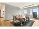 Bright dining room with a large wooden table and seating for eight with stunning city views at 3750 Las Vegas Blvd # 3008, Las Vegas, NV 89158