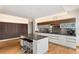 Modern kitchen featuring stainless steel appliances, island with seating, and dark wood accents at 3750 Las Vegas Blvd # 3008, Las Vegas, NV 89158