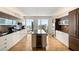 Modern kitchen with stainless steel appliances, a center island, and floor-to-ceiling windows at 3750 Las Vegas Blvd # 3008, Las Vegas, NV 89158