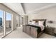 Bright primary bedroom with large windows showcasing city views and a king bed with side tables at 3750 Las Vegas Blvd # 3008, Las Vegas, NV 89158