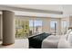 Bright primary bedroom featuring floor-to-ceiling windows with stunning city views and a neutral color palette at 3750 Las Vegas Blvd # 3008, Las Vegas, NV 89158