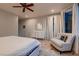 Spacious bedroom with neutral colors, dresser, and an upholstered chair at 379 Fynn Valley Dr, Las Vegas, NV 89148
