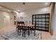 Bright dining area featuring neutral walls, tile flooring, modern lighting, and a display cabinet at 379 Fynn Valley Dr, Las Vegas, NV 89148