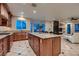 Open kitchen with a large island, granite countertops, stainless appliances, and seamless flow to the living area at 379 Fynn Valley Dr, Las Vegas, NV 89148
