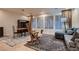 Open-concept living and dining area featuring tile floors, neutral walls, and lots of natural light at 379 Fynn Valley Dr, Las Vegas, NV 89148