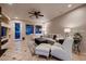 Inviting living room featuring neutral tones, tile flooring, and a cozy seating arrangement at 379 Fynn Valley Dr, Las Vegas, NV 89148