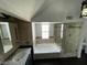 Vaulted bathroom with a soaking tub, glass-enclosed shower, neutral tile, and modern fixtures, offering a spa-like experience at 4037 Chalfont Ct, Las Vegas, NV 89121
