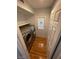 Compact laundry room with modern washer and dryer, storage shelves, and access to the exterior, adding convenience at 4037 Chalfont Ct, Las Vegas, NV 89121