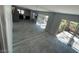 Open living area features tile flooring, sliding glass doors leading to a patio, and mirrored wall accents at 4037 Chalfont Ct, Las Vegas, NV 89121