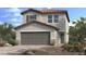 Beautiful two-story home with a two car garage, desert landscaping, and a tile roof at 4145 Texas Lilac Ave, Las Vegas, NV 89139