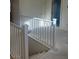 Clean staircase featuring white railings and carpeted steps at 4145 Texas Lilac Ave, Las Vegas, NV 89139