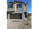 Inviting two-story home featuring a two car garage and low maintenance front yard at 4153 Texas Lilac Ave, Las Vegas, NV 89139