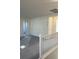 Open loft area with neutral carpet, ample natural light, and a white railing at 4153 Texas Lilac Ave, Las Vegas, NV 89139
