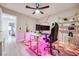 Bright bedroom with a contemporary ceiling fan, geometric rug, and modern shelving unit at 4211 Saxton Green Ave, Las Vegas, NV 89141