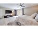 Serene bedroom featuring a large TV, soft carpet, and stylish decor creates a luxurious retreat at 4211 Saxton Green Ave, Las Vegas, NV 89141