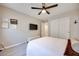 This bedroom features a bed, a large closet, decor and a modern ceiling fan at 4211 Saxton Green Ave, Las Vegas, NV 89141