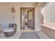 Inviting front entrance featuring a decorative door with glass panels and a cozy seating area at 4211 Saxton Green Ave, Las Vegas, NV 89141
