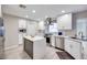 Modern kitchen with white cabinetry, stainless steel appliances, and center island at 4211 Saxton Green Ave, Las Vegas, NV 89141