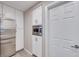Modern kitchen features white cabinetry, stainless steel appliances, and a built-in microwave at 4211 Saxton Green Ave, Las Vegas, NV 89141