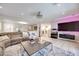 Open living room with recessed lighting, wood floors, and a stylish modern design at 4211 Saxton Green Ave, Las Vegas, NV 89141