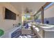 Outdoor patio with a ceiling fan, an outdoor television, outdoor furniture and a grill at 4211 Saxton Green Ave, Las Vegas, NV 89141